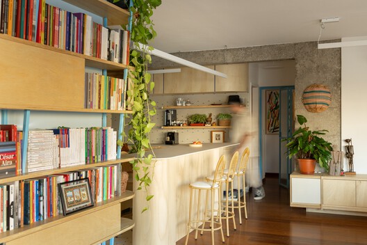 João Moura Apartment / Margem Arquitetos João Moura Apartment / Margem Arquitetos - Interior Photography, Closet, Shelving, Wood, Lighting, Table, Chair