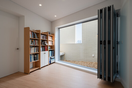 JH Gwangan Mixed-use building  / U.GA Architects - Interior Photography, Closet, Wood, Lighting, Glass