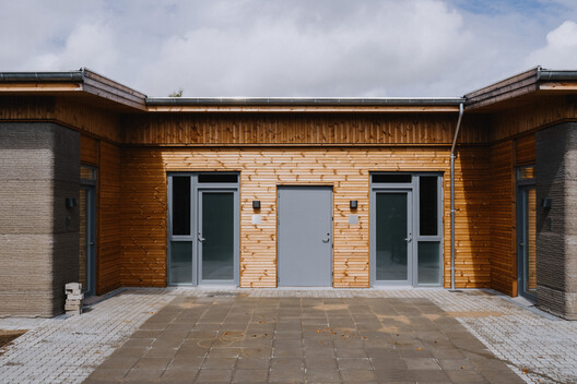 Skovsporet 3D-Printed Student Housing / SAGA Space Architects Skovsporet 3D-Printed Student Housing / SAGA Space Architects - Exterior Photography, Wood, Door, Brick, Concrete