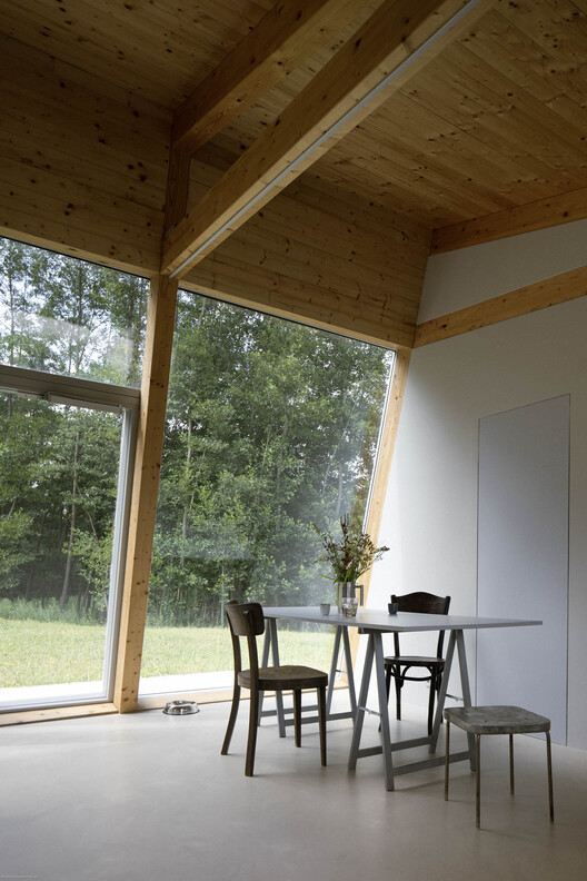 Modular House with a Sloping Facade / Papundekl Architects Modular House with a Sloping Facade / Papundekl Architects - Interior Photography, Dining room, Wood, Glass, Chair, Beam