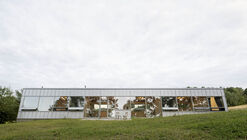 Modular house with a sloping facade / Papundekl Architects