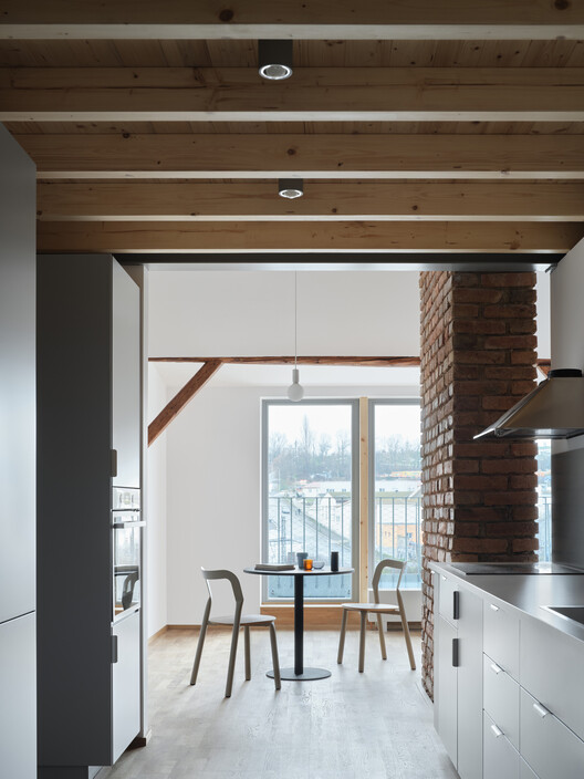Harfa Rooftop Extension / matěj šebek architekti Harfa Rooftop Extension / matěj šebek architekti - Interior Photography, Kitchen, Wood, Lighting, Countertop, Chair