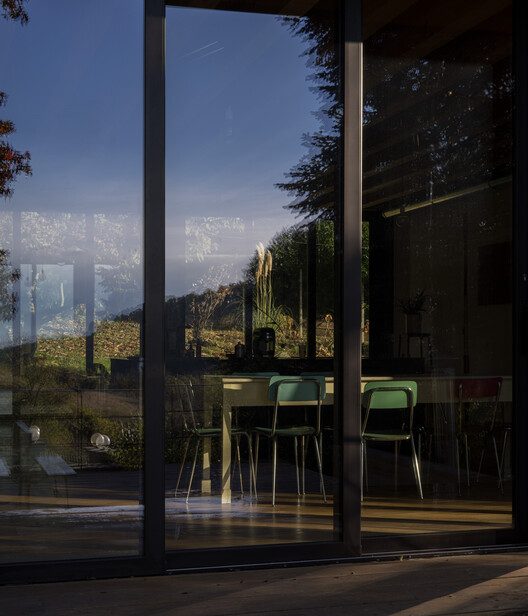 An unfinished domestic device as a threshold between interior and landscape / EX. An unfinished domestic device as a threshold between interior and landscape / EX. - Exterior Photography, Glass, Chair