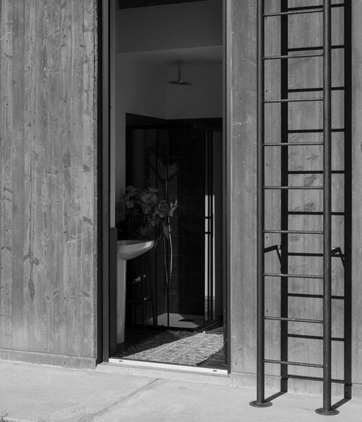 An unfinished domestic device as a threshold between interior and landscape / EX. An unfinished domestic device as a threshold between interior and landscape / EX. - Interior Photography, Wood, Door, Glass, Concrete