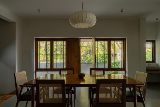 House Beyond the Mango Trees / inLe architects House Beyond the Mango Trees / inLe architects - Interior Photography, Dining room, Wood, Table, Lighting, Chair, Glass
