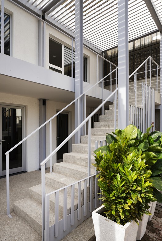 ITA - Italian Trade Agency Dakar / MOST Monti Studio ITA - Italian Trade Agency Dakar / MOST Monti Studio - Interior Photography, Stairs, Handrail, Balcony, Concrete, Courtyard