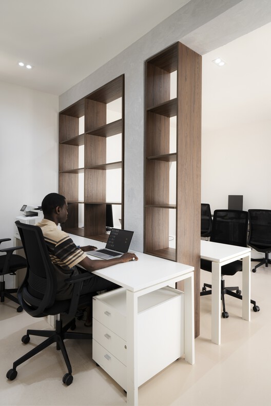 ITA - Italian Trade Agency Dakar / MOST Monti Studio ITA - Italian Trade Agency Dakar / MOST Monti Studio - Interior Photography, Shelving, Wood, Table, Chair, Lighting