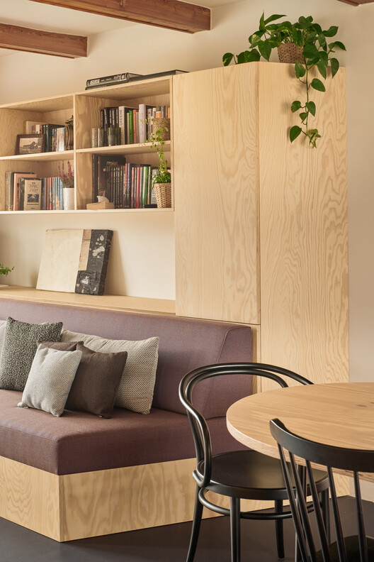 House With a Red Addition / Facha architekti House With a Red Addition / Facha architekti - Interior Photography, Living Room, Wood, Table, Lighting, Shelving, Chair