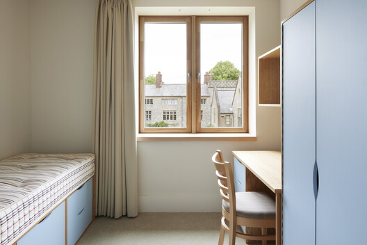 Winchester College Girls Boarding Houses / Stanton Williams Winchester College Girls Boarding Houses / Stanton Williams - Interior Photography, Bedroom, Wood, Lighting, Shelving, Bed
