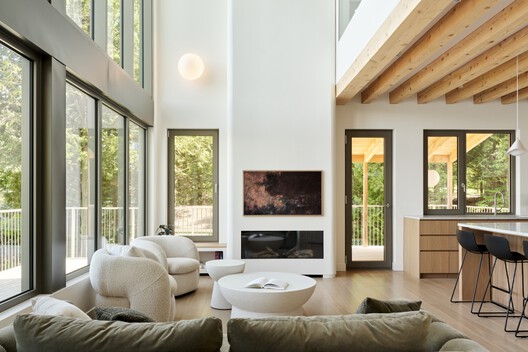 Wild Pond Villa / L. McComber  - Interior Photography, Living Room, Wood, Sofa, Table, Lighting, Chair